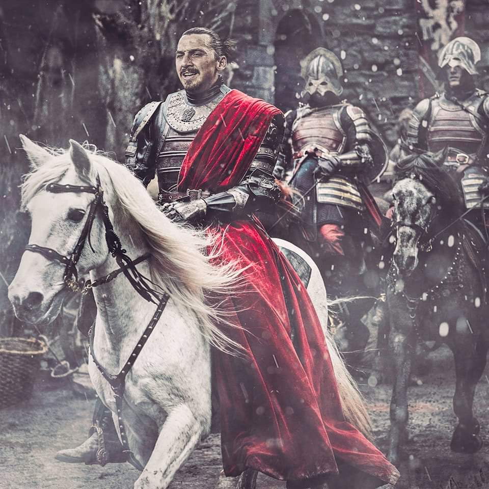 دخول زلاتان ابراهيموفيتش عالم التمثيل يمتطي حصان ويرتدي لباس محارب قديم وبجانبه عدد من الممثلين