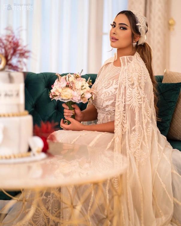 ريم ارحمة بفستان زفاف مع بوكيه ورد